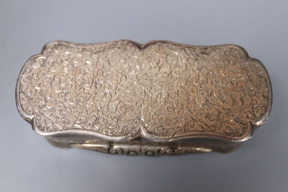 A late Victorian engraved silver shaped oval snuff box, Colen Hewer Cheshire, Birmingham, 1893, 82mm, 89.4 grams.